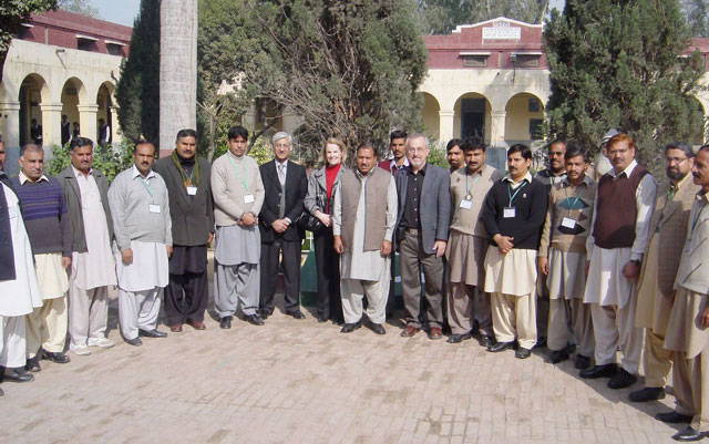 Naveed Malik, Elizabeth Murray and Richard Larson pictured with Pakistan teachers at a government high school. 