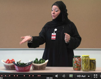Instructor pointing to pickle jars